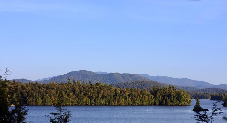 Lake and rolling hills with green forest in Upstate New York