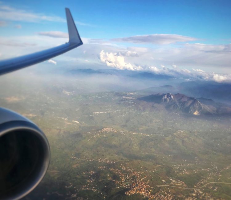 Plane wing and engine with the beautiful scape in the background